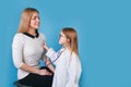 Smiling little girl playing doctor and listening her mother with stethoscope Royalty Free Stock Photo