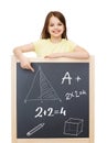 Smiling little girl pointing finger to blackboard Royalty Free Stock Photo