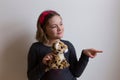 Smiling little girl pointing something to her plush toy Royalty Free Stock Photo