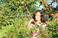 Girl under apple tree Royalty Free Stock Photo
