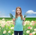 Smiling little girl with rake and scoop Royalty Free Stock Photo