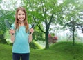 Smiling little girl with rake and scoop Royalty Free Stock Photo