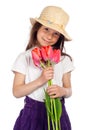 Smiling little girl with red tulips Royalty Free Stock Photo