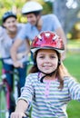 Smiling little girl riding a bike Royalty Free Stock Photo