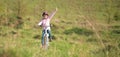 Smiling little girl riding a bike Royalty Free Stock Photo