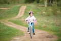 Smiling little girl riding a bike Royalty Free Stock Photo