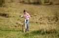 Smiling little girl riding a bike Royalty Free Stock Photo