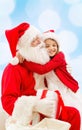 Smiling little girl with santa claus Royalty Free Stock Photo