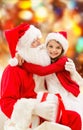 Smiling little girl with santa claus Royalty Free Stock Photo