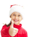 smiling little girl in Santa hat showing thumb Royalty Free Stock Photo