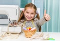 Smiling little girl at the table with sewing Royalty Free Stock Photo