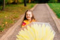Smiling little girl with umbrella in raincoat and boots outdoor Royalty Free Stock Photo