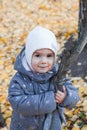 Smiling little girl walking in autumn park Royalty Free Stock Photo