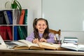 smiling little girl is watching a video lesson on the computer. Royalty Free Stock Photo