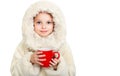 Smiling little girl in winter clothes with a red cup of hot drink Royalty Free Stock Photo