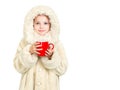 Smiling little girl in winter clothes with a red cup of hot drink Royalty Free Stock Photo