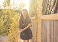 Smiling little girl on wooden porch Royalty Free Stock Photo