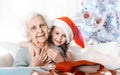 Granddaughter in sit hugging with grandma Royalty Free Stock Photo