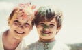 Smiling little kids portrait. Painted faces of funny kids. Children holi festival of colors. Little boy and girl plays Royalty Free Stock Photo