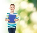 Smiling little student boy with blue book Royalty Free Stock Photo