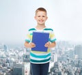 Smiling little student boy with blue book Royalty Free Stock Photo