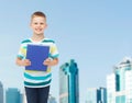 Smiling little student boy with blue book Royalty Free Stock Photo