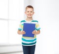 Smiling little student boy with blue book Royalty Free Stock Photo