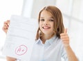 Smiling little student girl with test and A grade Royalty Free Stock Photo