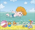 Boy swimming in water on a beach