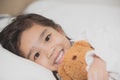 Smiling littlegirl with a teddy bear