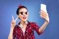 Smiling lovely active asian girl taking selfie photo. Royalty Free Stock Photo