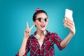 Smiling lovely active asian girl taking selfie photo. Royalty Free Stock Photo