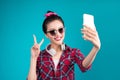 Smiling lovely active asian girl taking selfie photo. Royalty Free Stock Photo