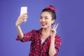 Smiling lovely active asian girl taking selfie photo. Royalty Free Stock Photo