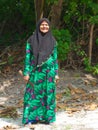 Smiling maldivian old woman in traditional clothes