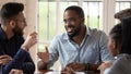 Smiling male african leader talking to colleagues at office briefing Royalty Free Stock Photo