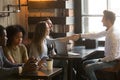 Smiling male broker greeting customers with handshake at cafe me Royalty Free Stock Photo