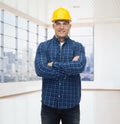 Smiling male builder or manual worker in helmet Royalty Free Stock Photo