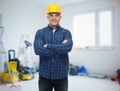 Smiling male builder or manual worker in helmet