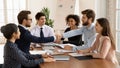 Smiling male partners handshake closing deal at meeting Royalty Free Stock Photo