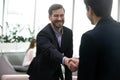 Smiling male business partners handshake at meeting Royalty Free Stock Photo