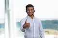 Smiling male call center operator gesturing thumb up. Royalty Free Stock Photo