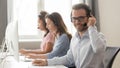 Smiling male call center operator in headset looking at camera Royalty Free Stock Photo