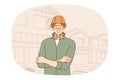 Smiling male constructor in protective gear at building site Royalty Free Stock Photo