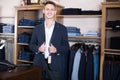 Smiling male customer searching new suit Royalty Free Stock Photo