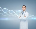 Smiling male doctor in white coat and dna molecule Royalty Free Stock Photo