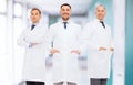 Smiling male doctors in white coats