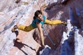 Smiling Male Extreme Climber hanging on unusual shaped Rock Royalty Free Stock Photo