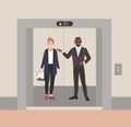 Smiling male and female office workers or clerks standing in elevator with open doors. Colleagues having conversation Royalty Free Stock Photo