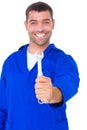 Smiling male mechanic showing spanner Royalty Free Stock Photo